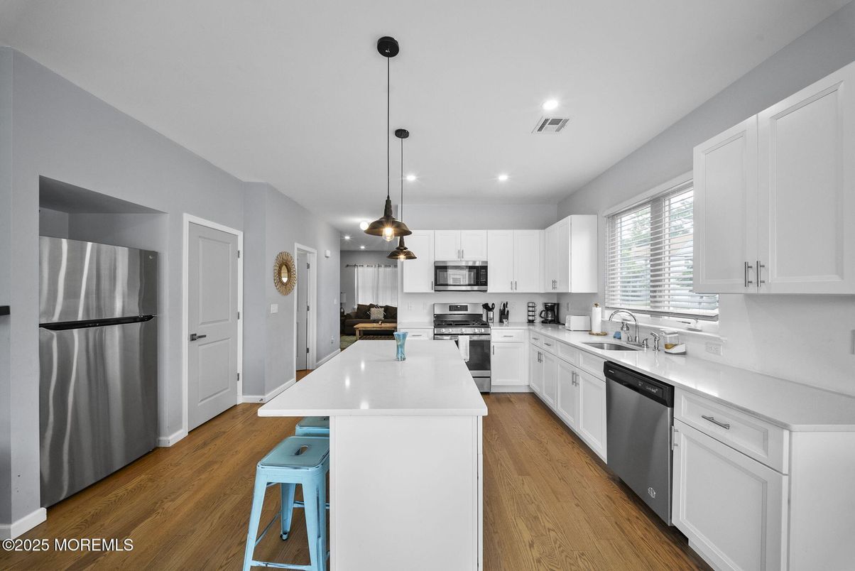 Interior, Kitchen, Pendant Lights, Recessed Lighting, Stainless Steel Appliances, Wood Texture Flooring