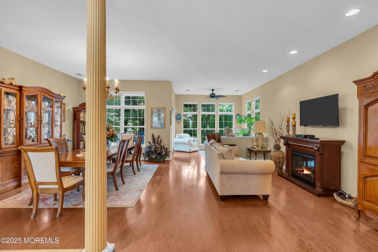 Dining room, Fireplace, Interior, Living room, Recessed Lighting, Wood Texture Flooring