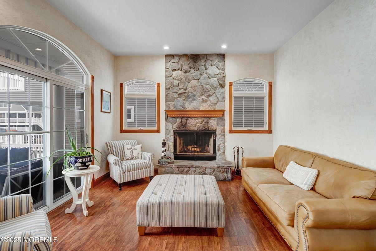Fireplace, Interior, Living room, Recessed Lighting, Stone Walls, Wood Texture Flooring
