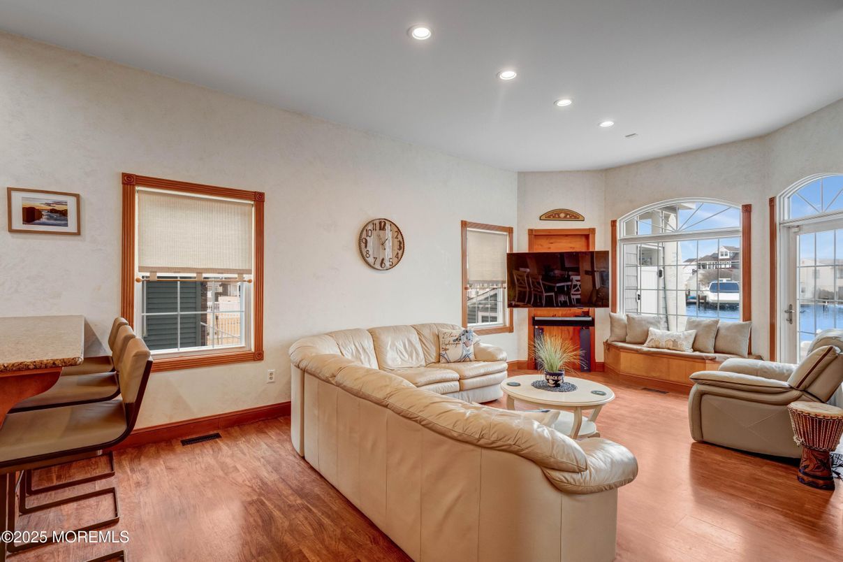 Fireplace, Interior, Living room, Recessed Lighting, Water, Wood Texture Flooring