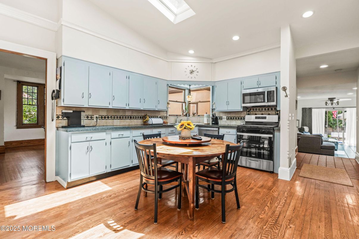 Dining room, Interior, Kitchen, Recessed Lighting, Stainless Steel Appliances, Wood Texture Flooring