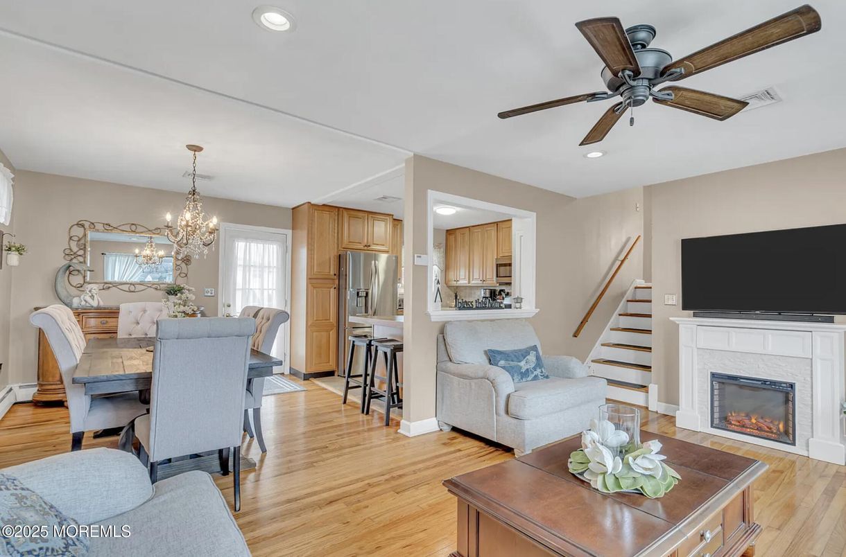 Chandelier, Dining room, Fireplace, Interior, Kitchen, Recessed Lighting, Wood Texture Flooring
