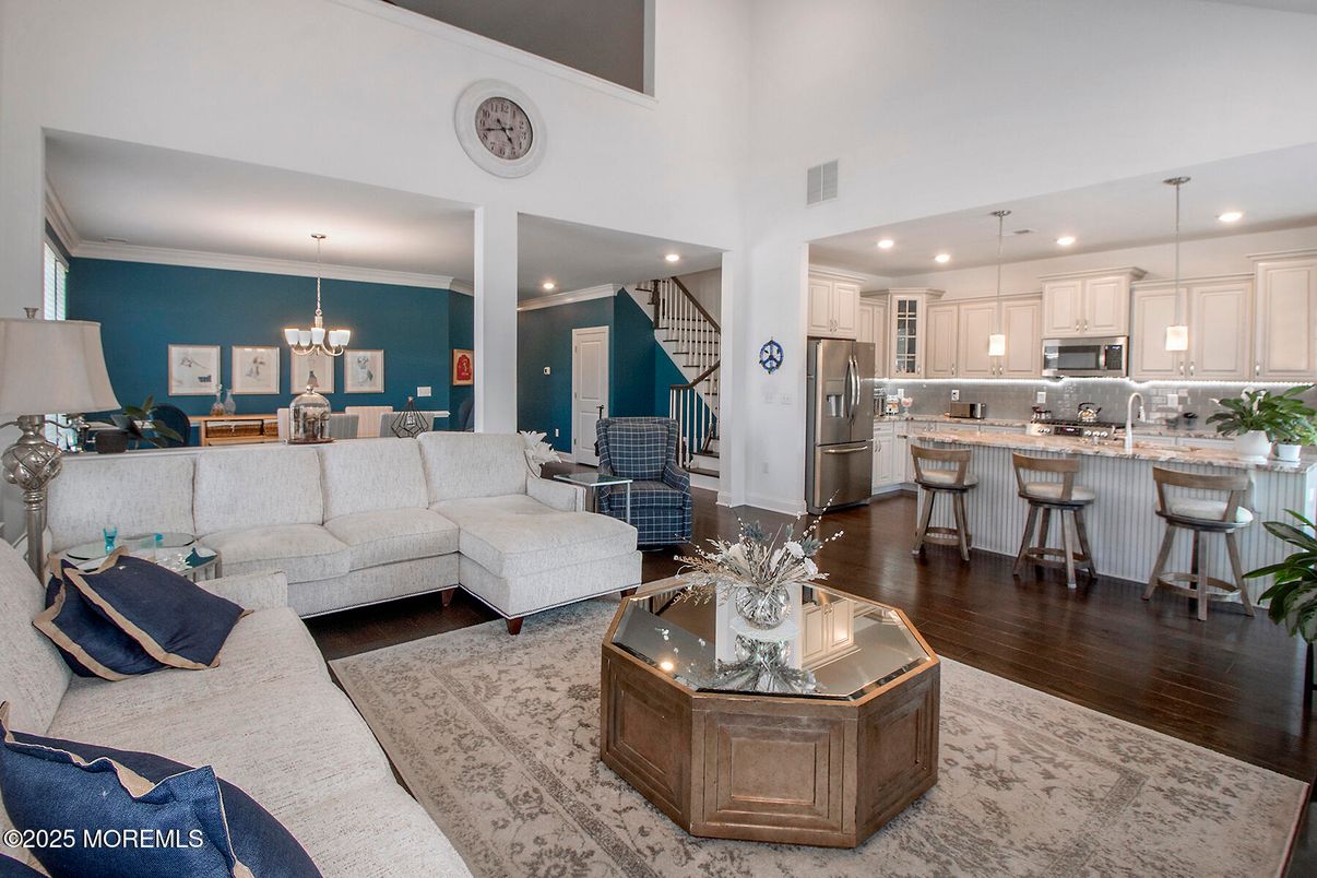 Chandelier, Dining room, Interior, Kitchen, Living room, Pendant Lights, Recessed Lighting, Stainless Steel Appliances, Wood Texture Flooring