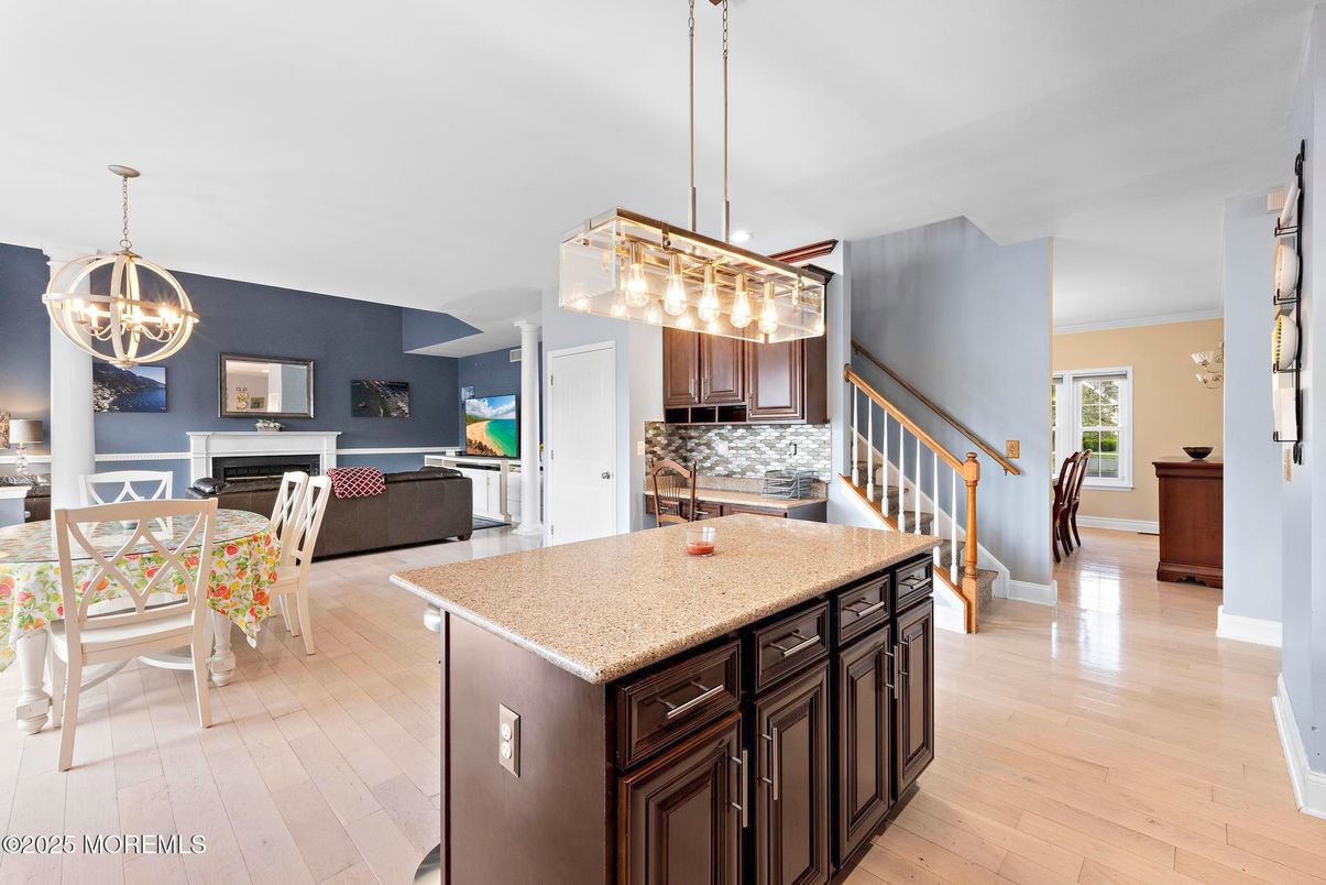 Chandelier, Dining room, Fireplace, Interior, Kitchen, Living room, Pendant Lights, Wood Texture Flooring