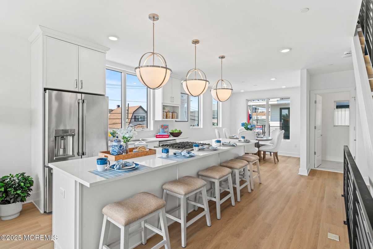 Dining room, Interior, Kitchen, Pendant Lights, Recessed Lighting, Stainless Steel Appliances, Wood Texture Flooring