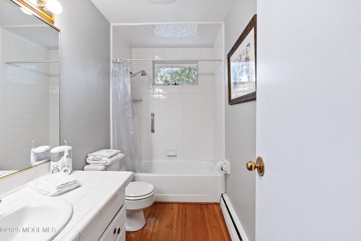 Bathroom, Glass Shower, Interior, Tile Countertops, Wood Texture Flooring