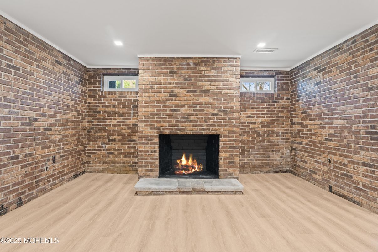Empty room, Fireplace, Interior, Recessed Lighting, Stone Walls, Wood Texture Flooring