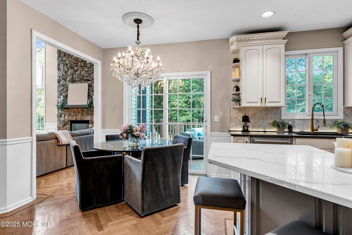Chandelier, Dining room, Fireplace, Interior, Kitchen, Recessed Lighting, Wood Texture Flooring
