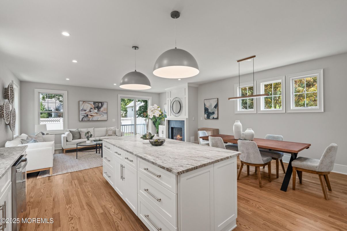 Dining room, Fireplace, Interior, Living room, Pendant Lights, Recessed Lighting, Wood Texture Flooring