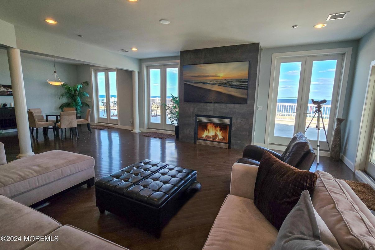 Dining room, Fireplace, Interior, Living room, Pendant Lights, Recessed Lighting, Water, Wood Texture Flooring