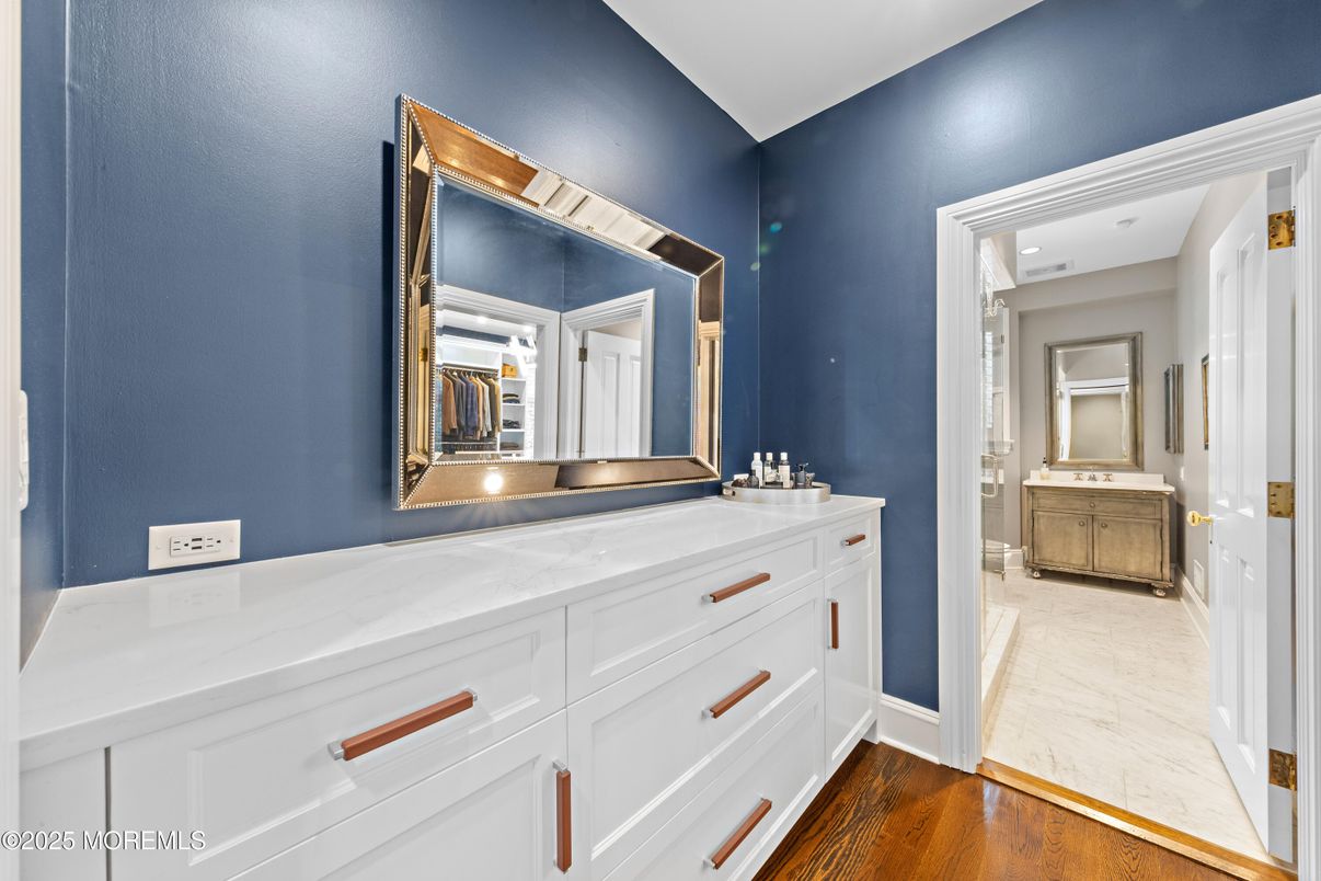 Bathroom, Dual Sink Vanities, Interior, Marble, Recessed Lighting, Wood Texture Flooring