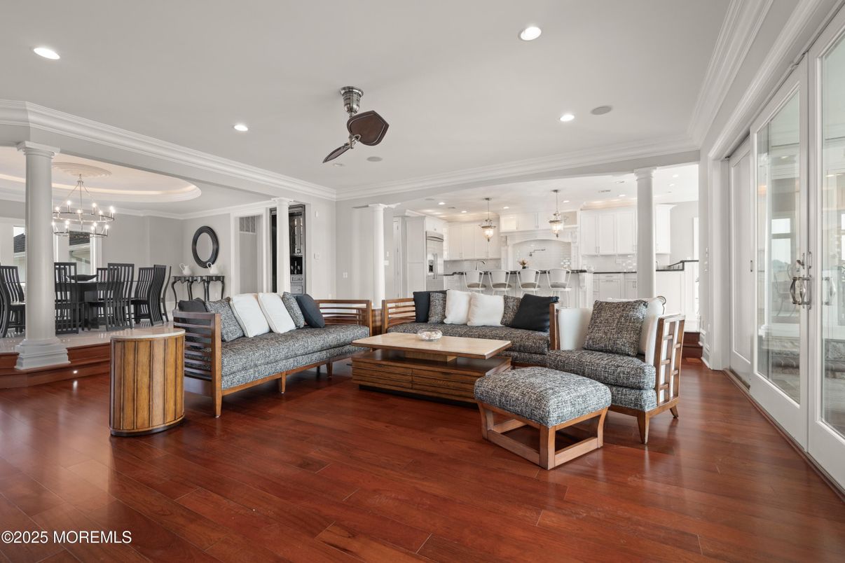 Chandelier, Dining room, Interior, Kitchen, Living room, Pendant Lights, Recessed Lighting, Stainless Steel Appliances, Wood Texture Flooring