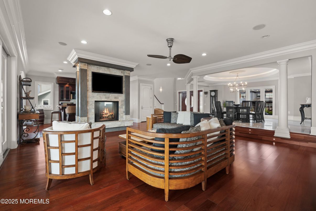 Chandelier, Dining room, Fireplace, Interior, Living room, Recessed Lighting, Wood Texture Flooring