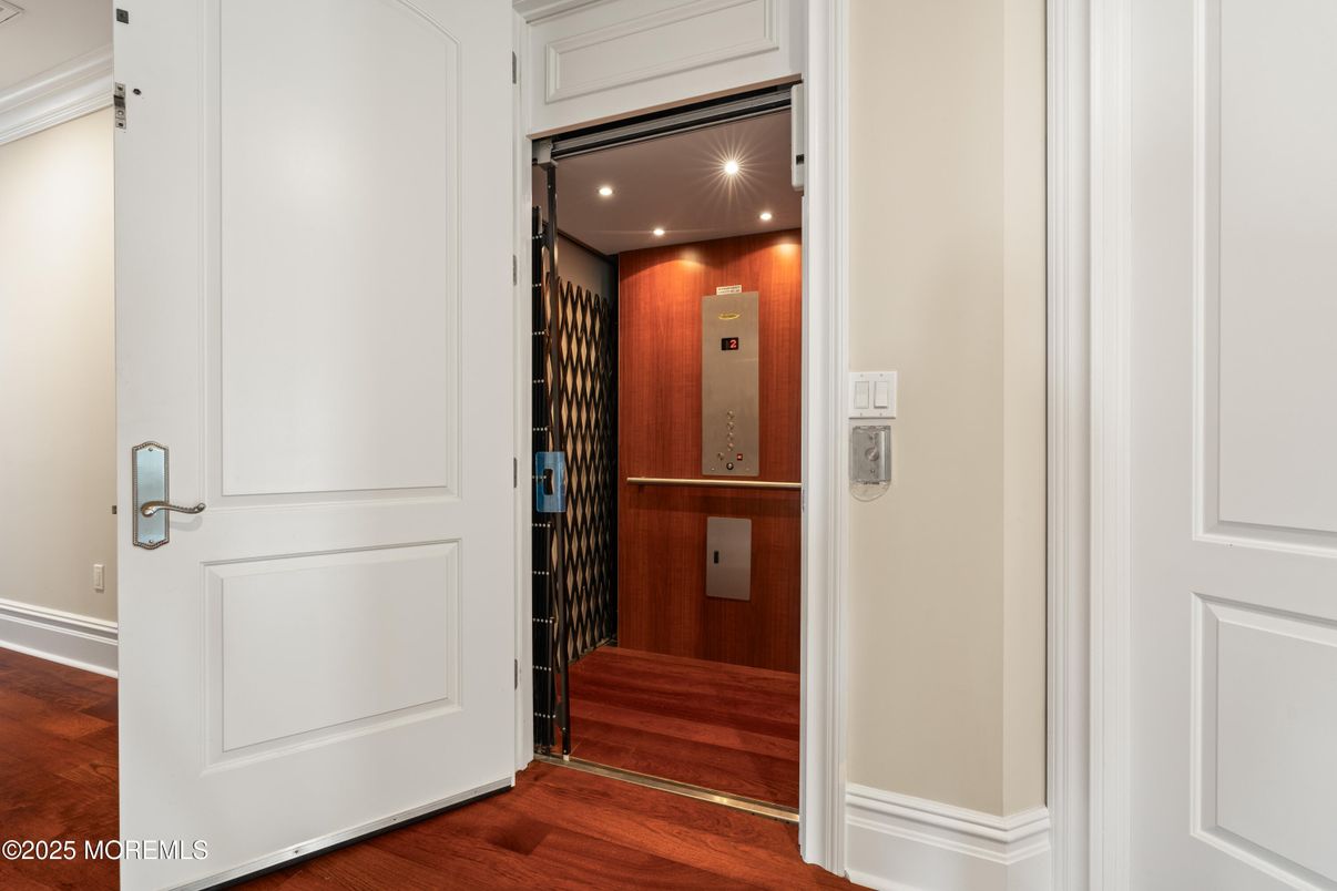 Elevator, Interior, Recessed Lighting, Wood Texture Flooring, Wooden Walls