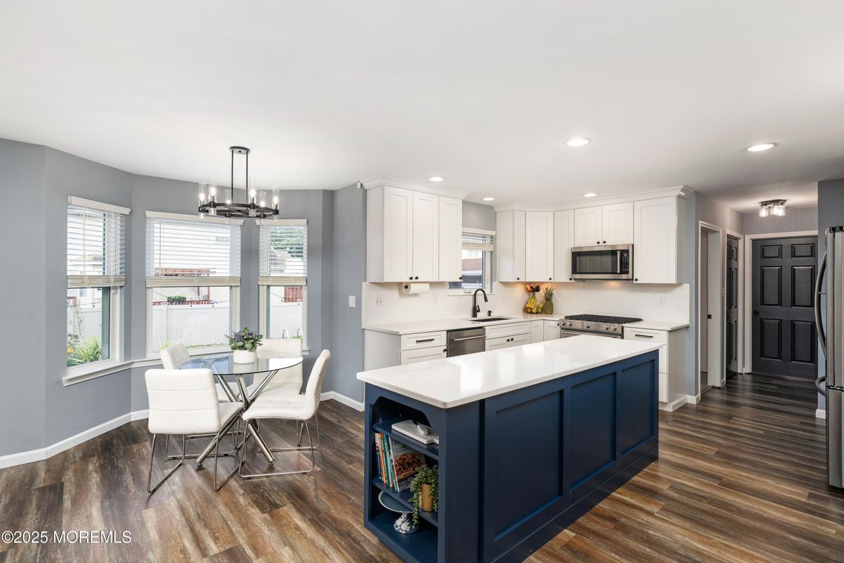 Dining room, Interior, Kitchen, Pendant Lights, Recessed Lighting, Stainless Steel Appliances, Wood Texture Flooring