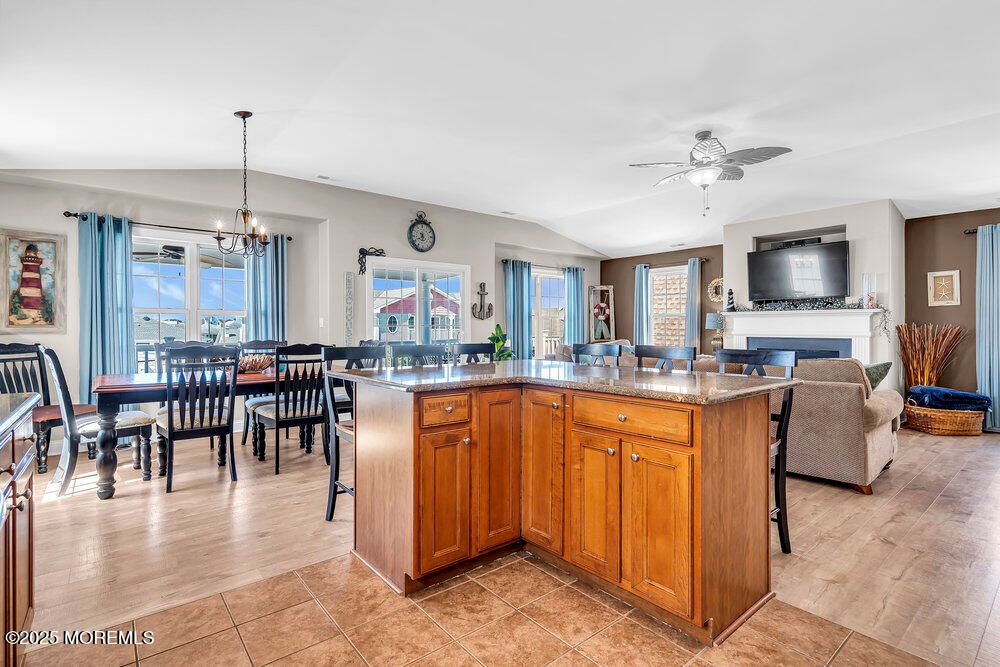 Chandelier, Dining room, Fireplace, Interior, Living room, Pendant Lights, Wood Texture Flooring