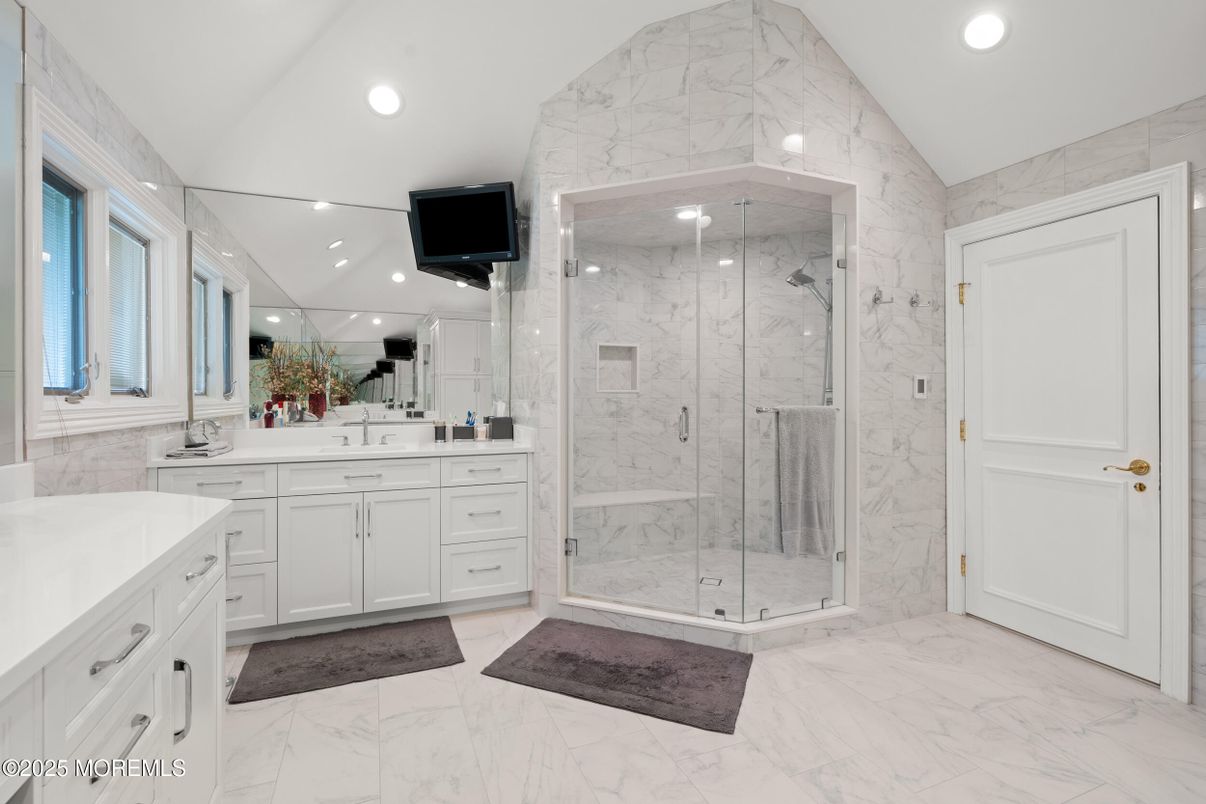 Bathroom, Dual Sink Vanities, Glass Shower, Interior, Marble, Marble Walls, Recessed Lighting