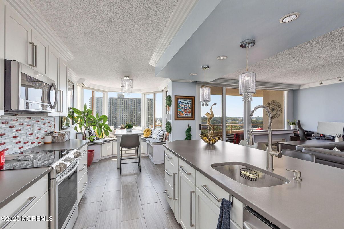 Dining room, Interior, Kitchen, Pendant Lights, Recessed Lighting, Stainless Steel Appliances, Wood Texture Flooring