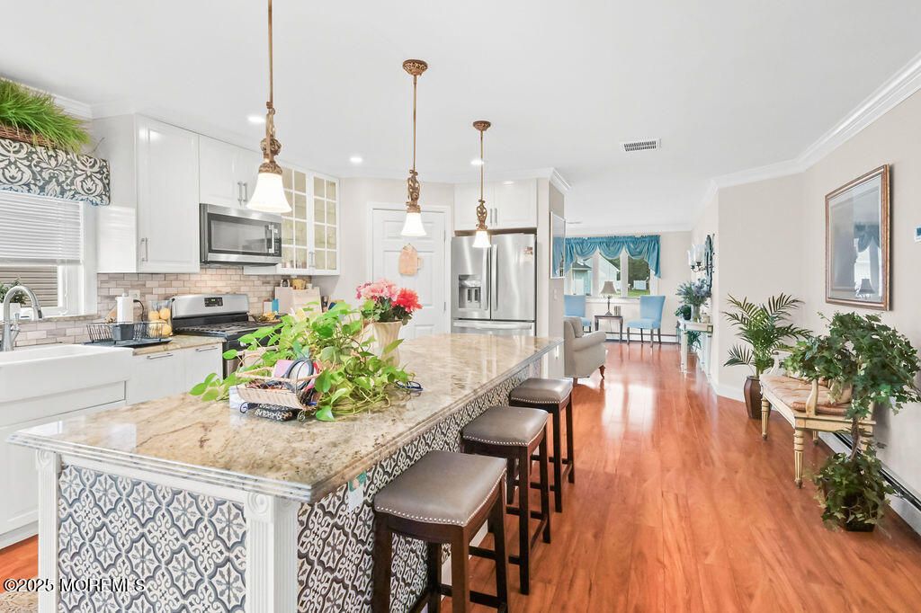 Dining room, Interior, Kitchen, Pendant Lights, Recessed Lighting, Stainless Steel Appliances, Wood Texture Flooring