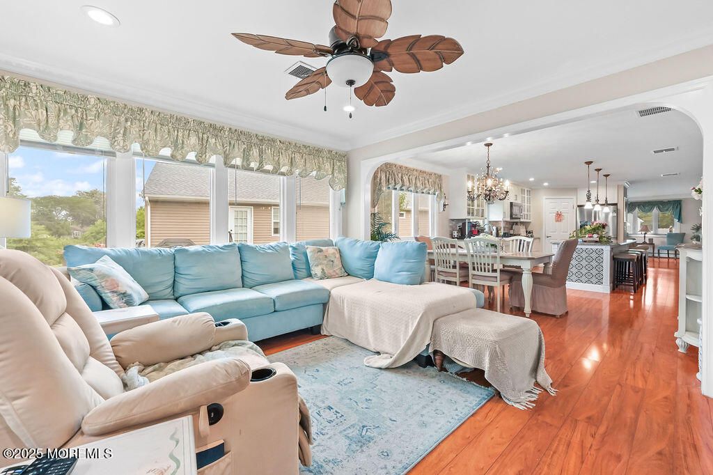 Chandelier, Dining room, Interior, Kitchen, Living room, Pendant Lights, Recessed Lighting, Stainless Steel Appliances, Wood Texture Flooring