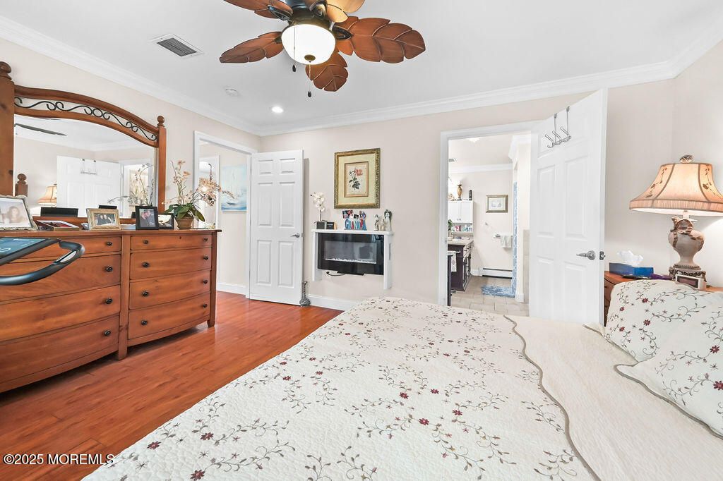 Bedroom, Fireplace, Interior, Kitchen, Recessed Lighting, Wood Texture Flooring