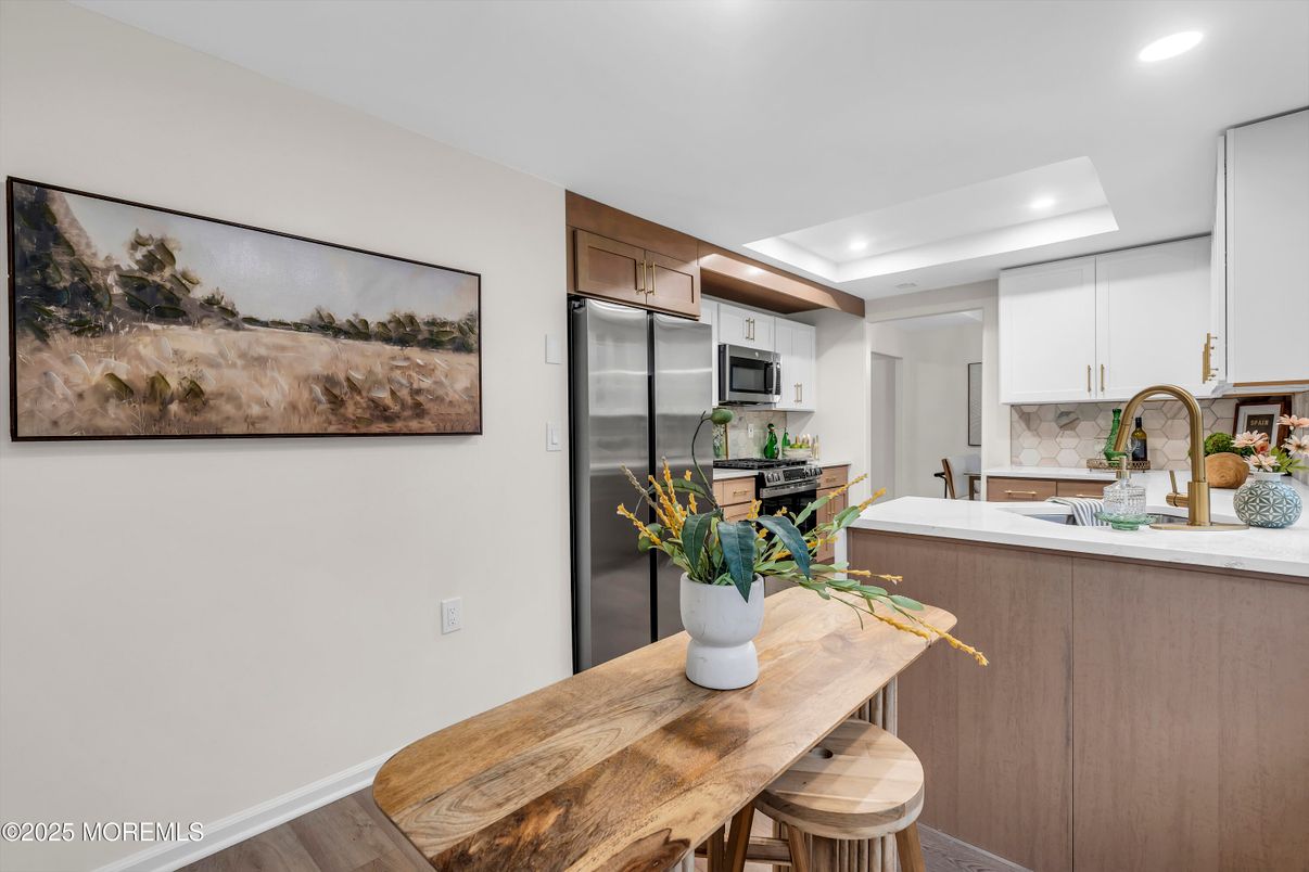 Dining room, Interior, Kitchen, Recessed Lighting, Stainless Steel Appliances, Wood Texture Flooring