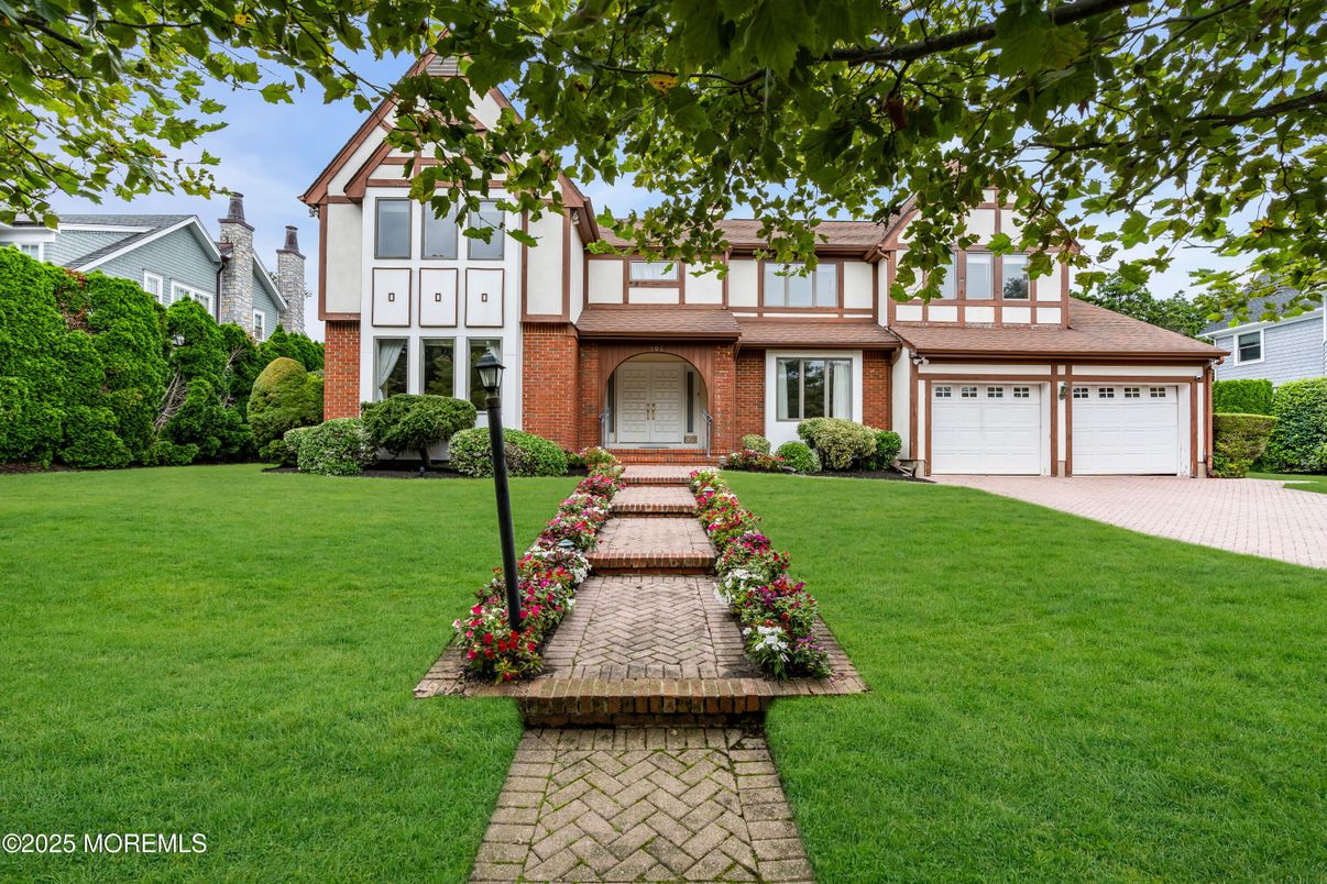 Attached, Backyard, Exterior, Facade, Brick Facade, Tudor Revival