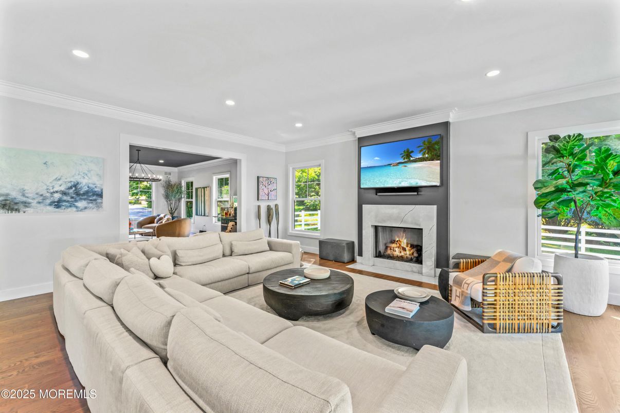 Dining room, Fireplace, Interior, Living room, Recessed Lighting, Wood Texture Flooring