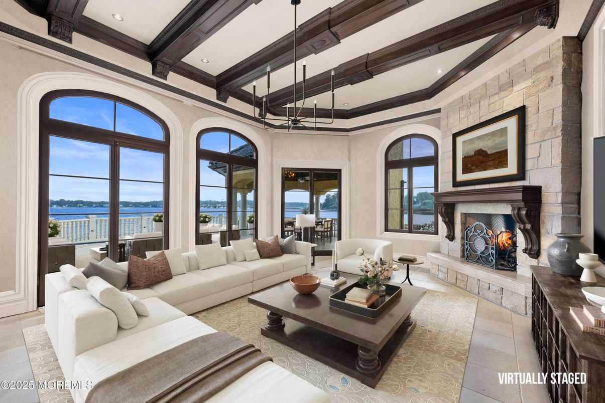 Fireplace, Interior, Living room, Recessed Lighting, Stone Walls, Water, Wooden Beams