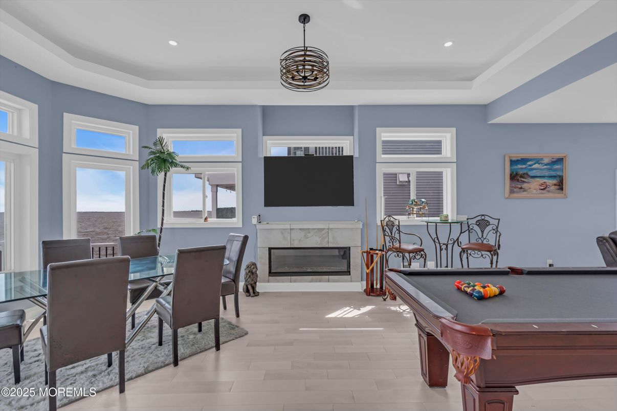 Billiard Table, Dining room, Fireplace, Game Room, Interior, Pendant Lights, Recessed Lighting, Wood Texture Flooring