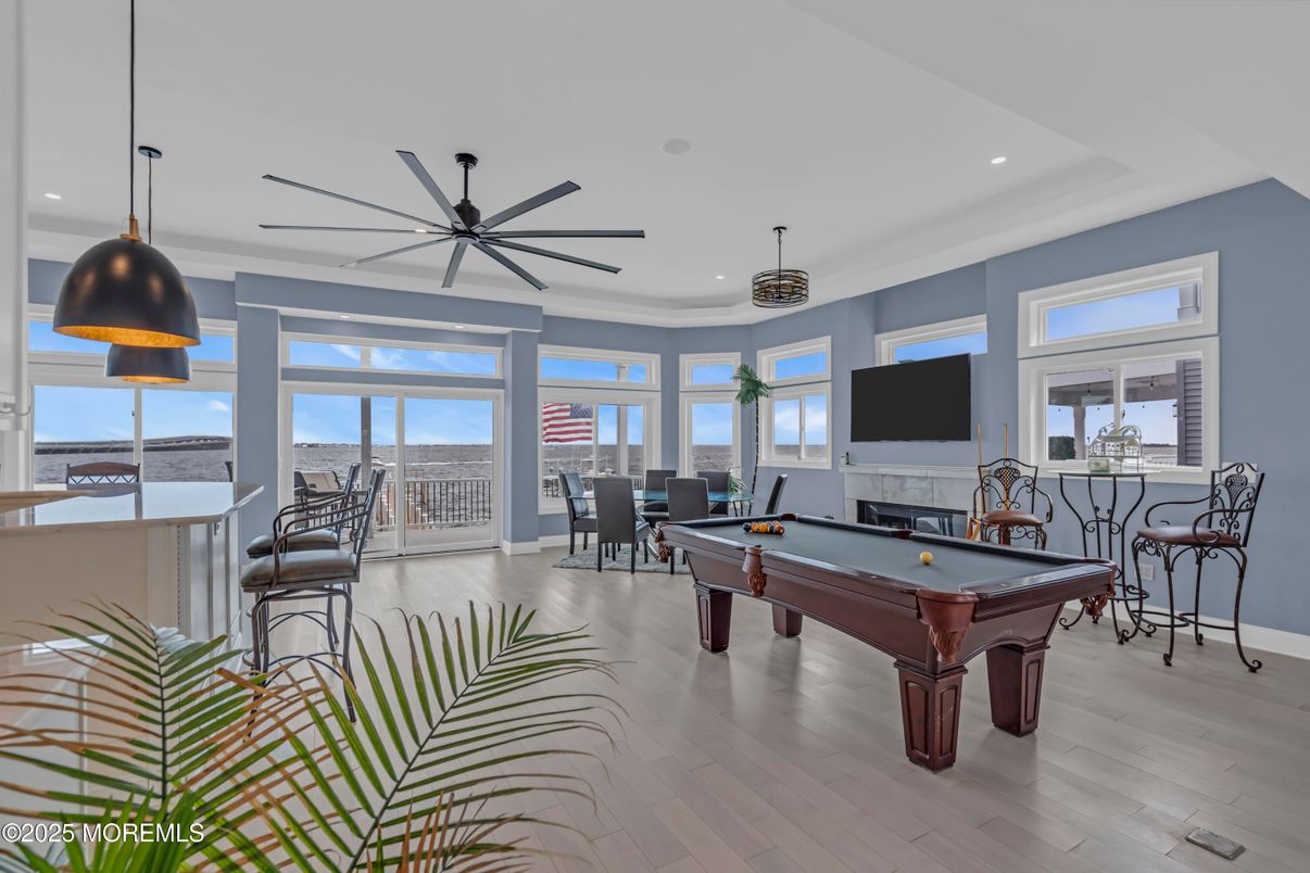 Billiard Table, Dining room, Fireplace, Game Room, Interior, Pendant Lights, Recessed Lighting, Wood Texture Flooring
