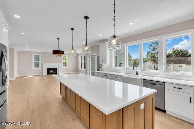 Fireplace, Interior, Kitchen, Pendant Lights, Recessed Lighting, Stainless Steel Appliances, Wood Texture Flooring