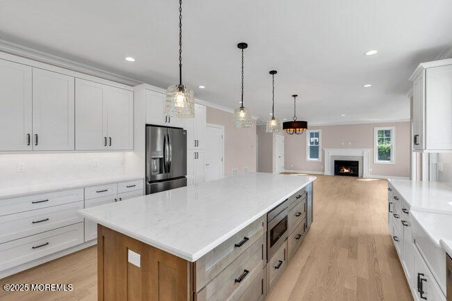 Fireplace, Interior, Kitchen, Pendant Lights, Recessed Lighting, Stainless Steel Appliances, Wood Texture Flooring