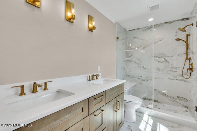 Bathroom, Dual Sink Vanities, Glass Shower, Interior, Marble, Marble Walls, Recessed Lighting