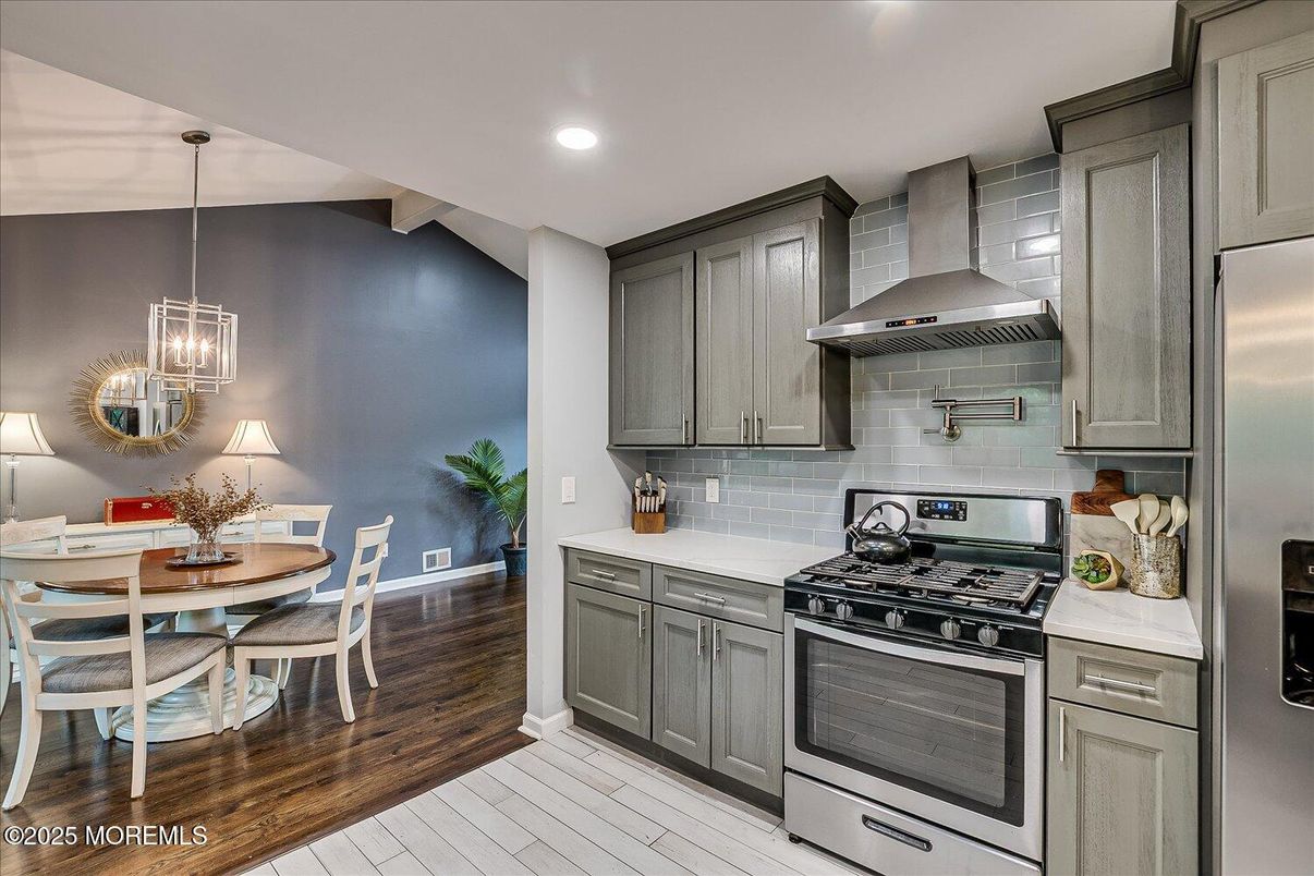Dining room, Interior, Kitchen, Pendant Lights, Recessed Lighting, Stainless Steel Appliances, Wood Texture Flooring