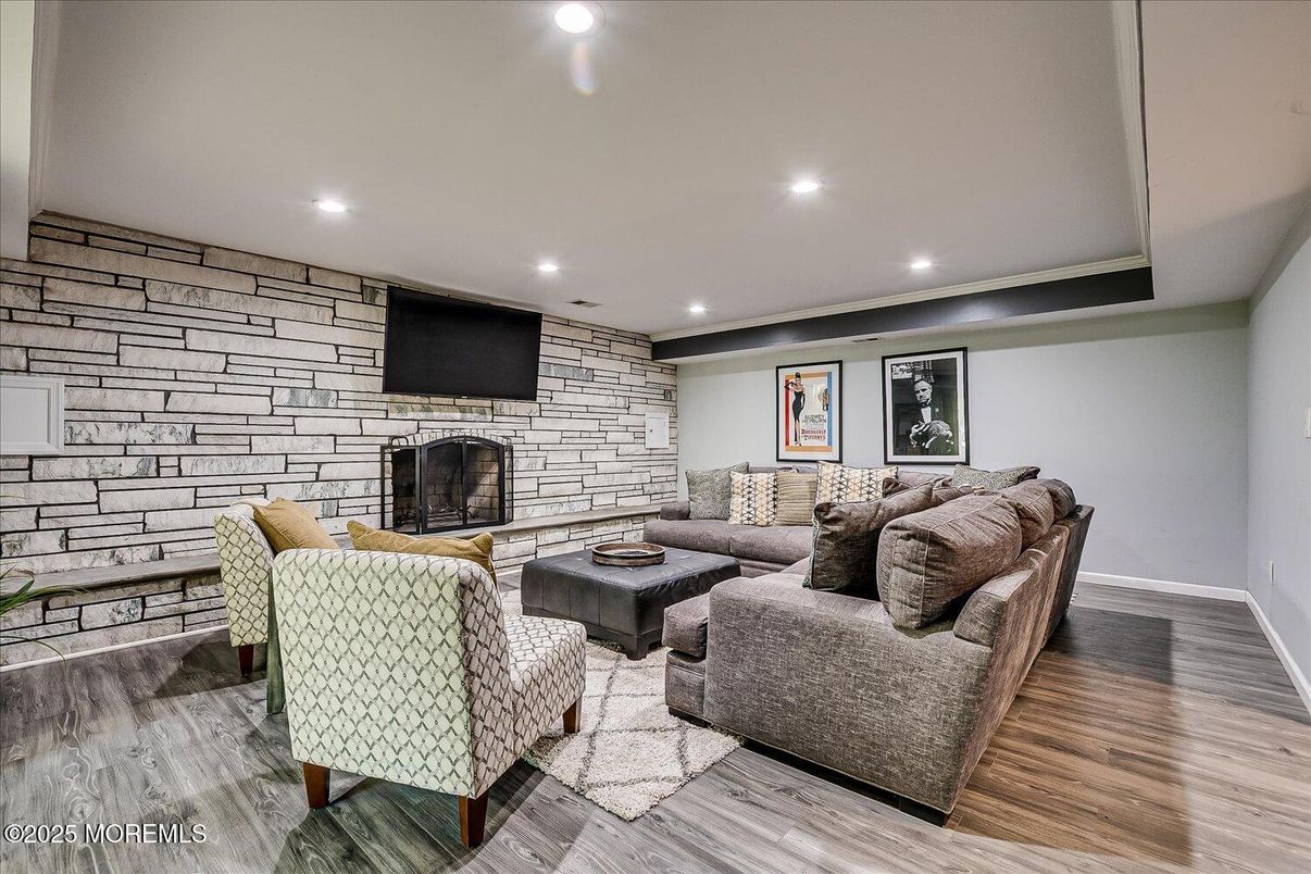 Fireplace, Interior, Living room, Recessed Lighting, Stone Walls, Wood Texture Flooring
