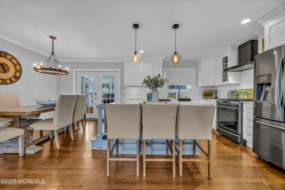 Chandelier, Dining room, Interior, Kitchen, Pendant Lights, Recessed Lighting, Stainless Steel Appliances, Wood Texture Flooring