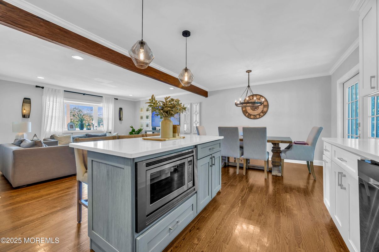Dining room, Interior, Kitchen, Living room, Pendant Lights, Recessed Lighting, Stainless Steel Appliances, Wooden Beams, Wood Texture Flooring