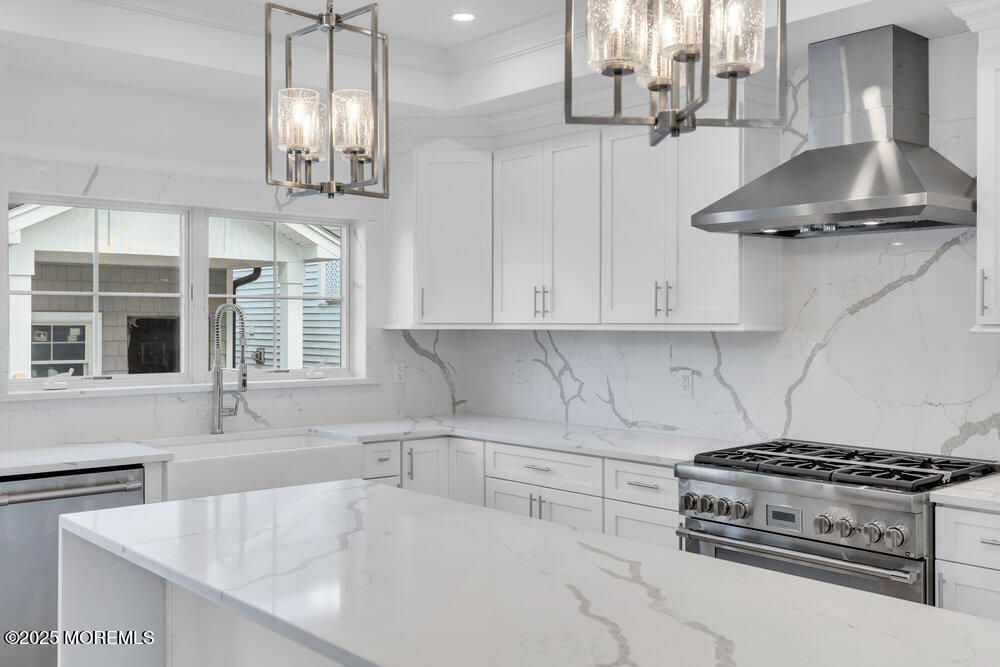 Interior, Kitchen, Marble Walls, Pendant Lights, Recessed Lighting, Stainless Steel Appliances
