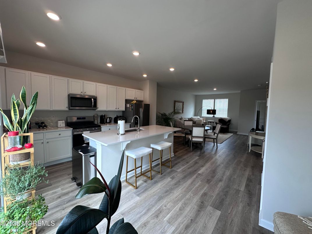 Dining room, Interior, Kitchen, Recessed Lighting, Stainless Steel Appliances, Wood Texture Flooring