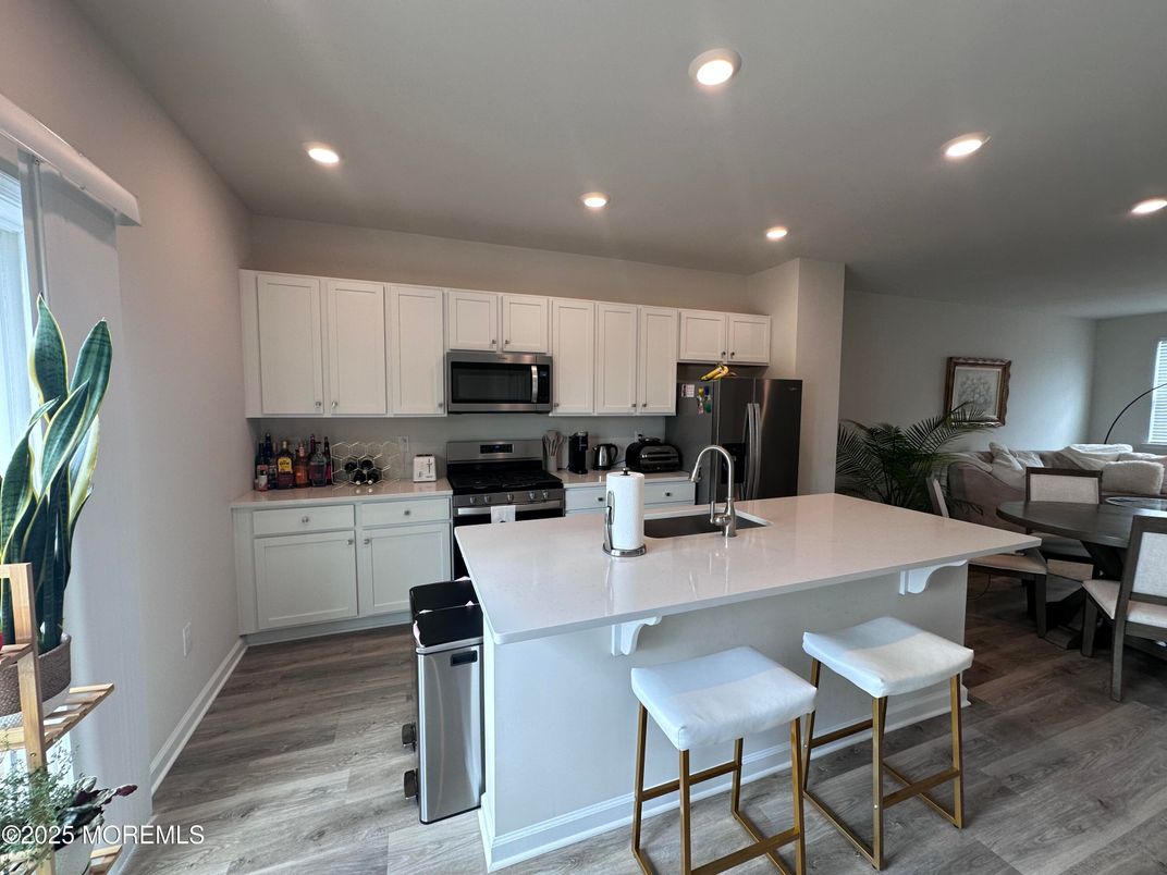 Dining room, Interior, Kitchen, Recessed Lighting, Stainless Steel Appliances, Wood Texture Flooring