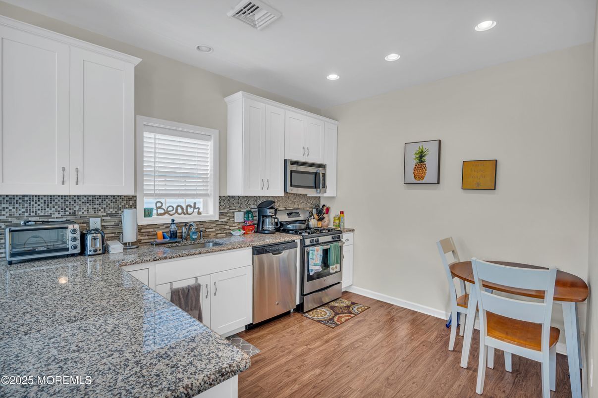 Dining room, Interior, Kitchen, Recessed Lighting, Stainless Steel Appliances, Wood Texture Flooring