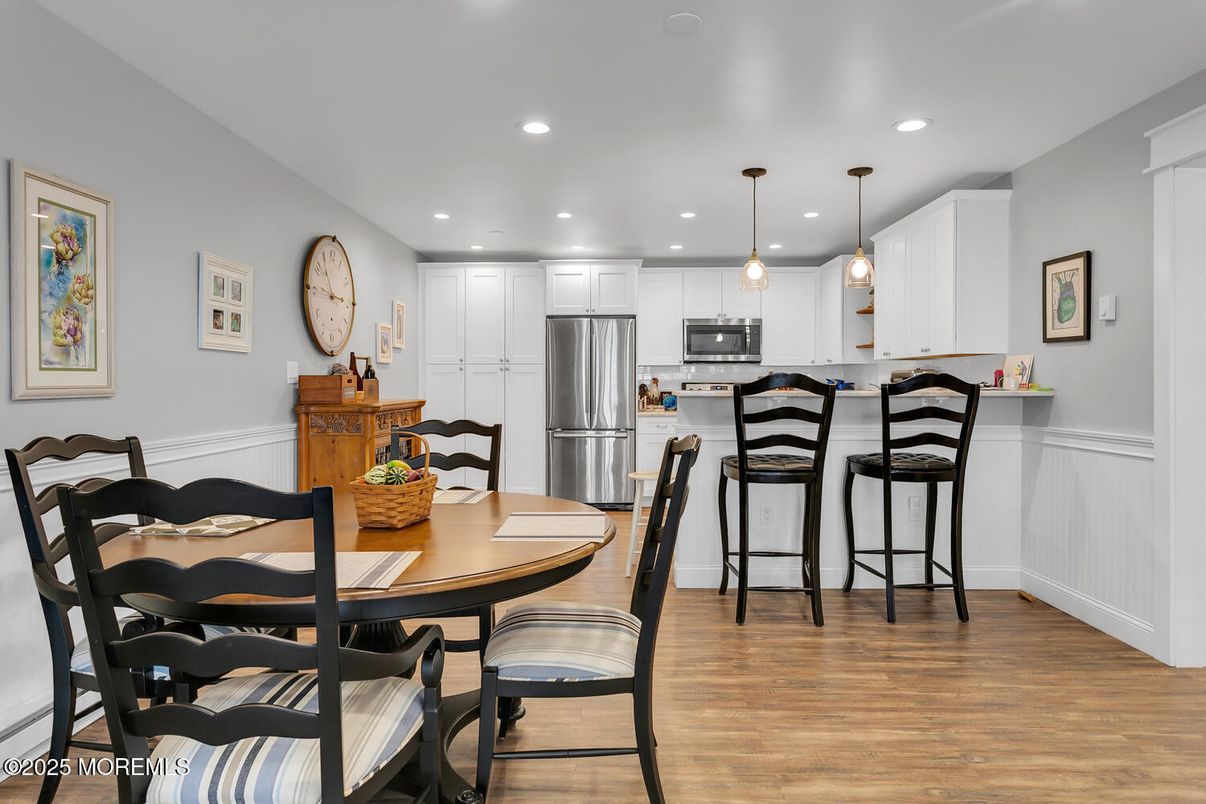 Dining room, Interior, Kitchen, Pendant Lights, Recessed Lighting, Stainless Steel Appliances, Wood Texture Flooring