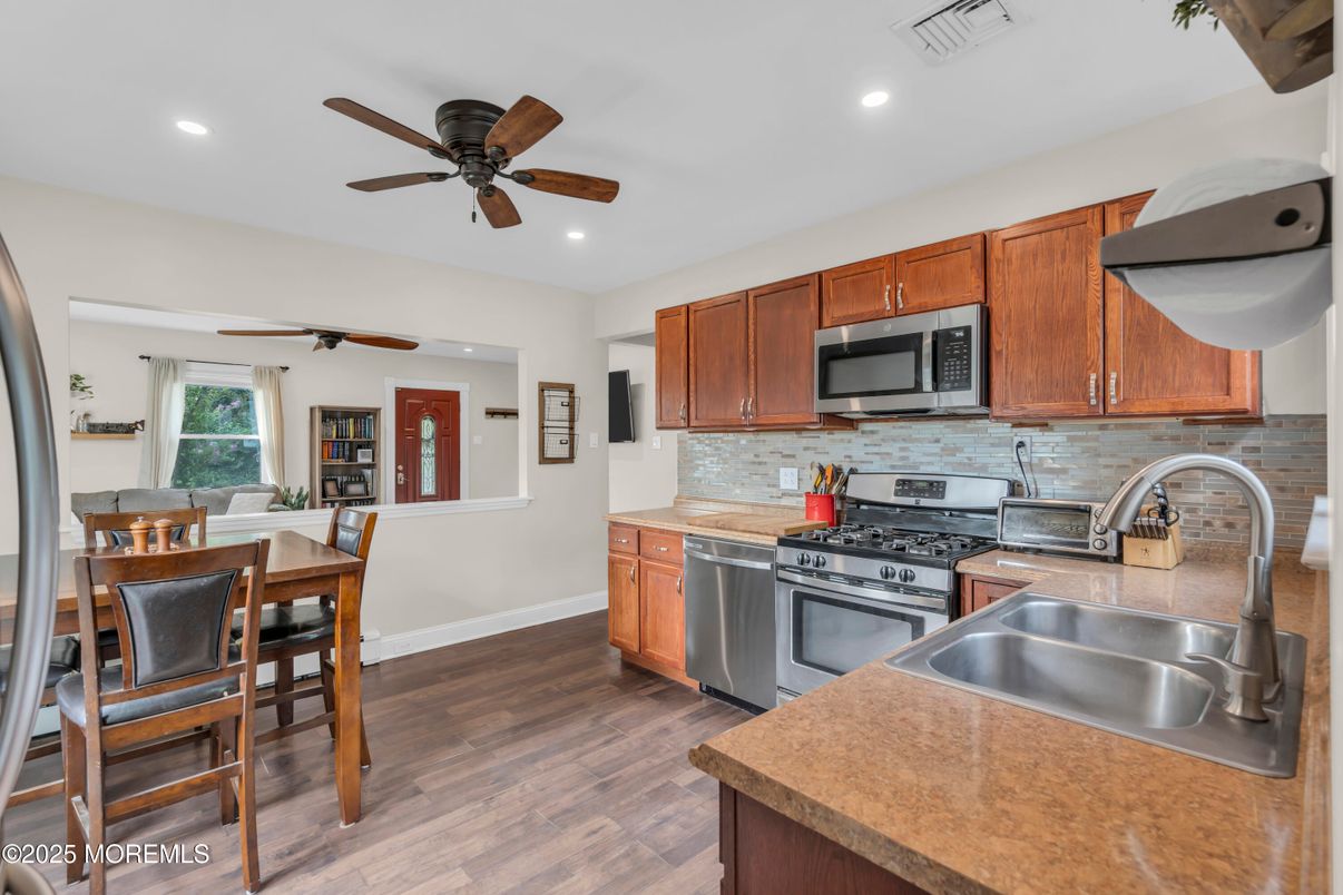 Dining room, Interior, Kitchen, Recessed Lighting, Stainless Steel Appliances, Wood Texture Flooring