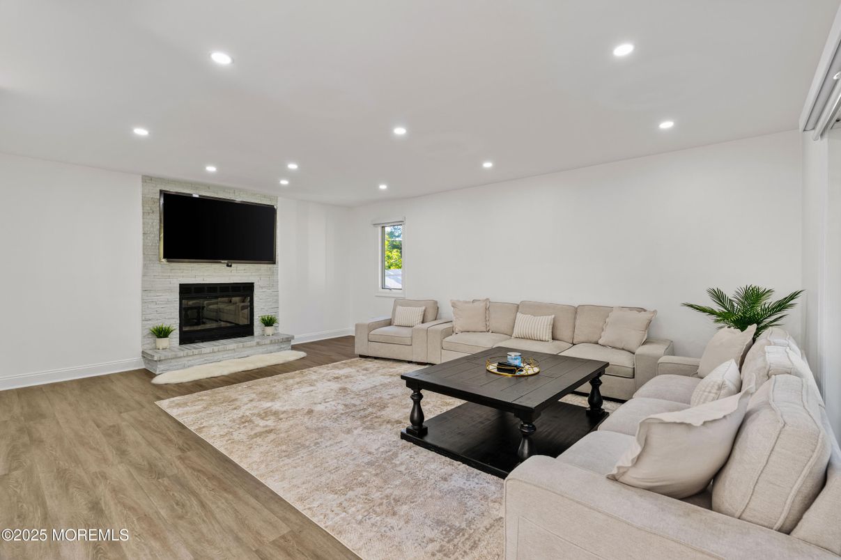 Fireplace, Interior, Living room, Recessed Lighting, Stone Walls, Wood Texture Flooring