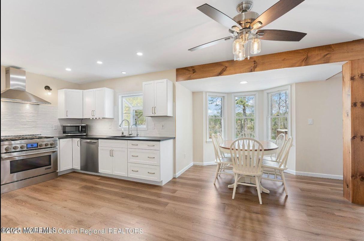 Dining room, Interior, Kitchen, Recessed Lighting, Stainless Steel Appliances, Wood Texture Flooring