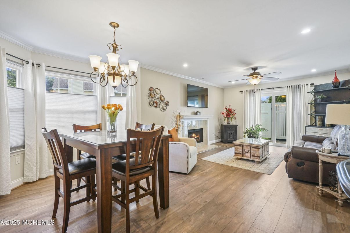 Chandelier, Dining room, Fireplace, Interior, Living room, Recessed Lighting, Wood Texture Flooring