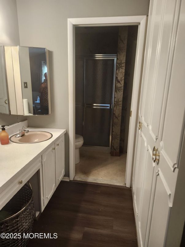 Bathroom, Dual Sink Vanities, Glass Shower, Interior, Wood Texture Flooring