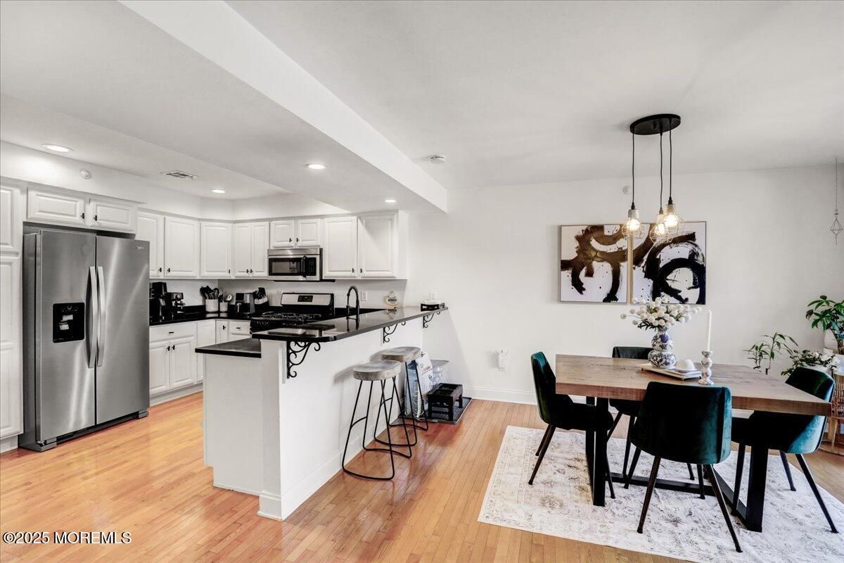 Dining room, Interior, Kitchen, Pendant Lights, Recessed Lighting, Stainless Steel Appliances, Wood Texture Flooring