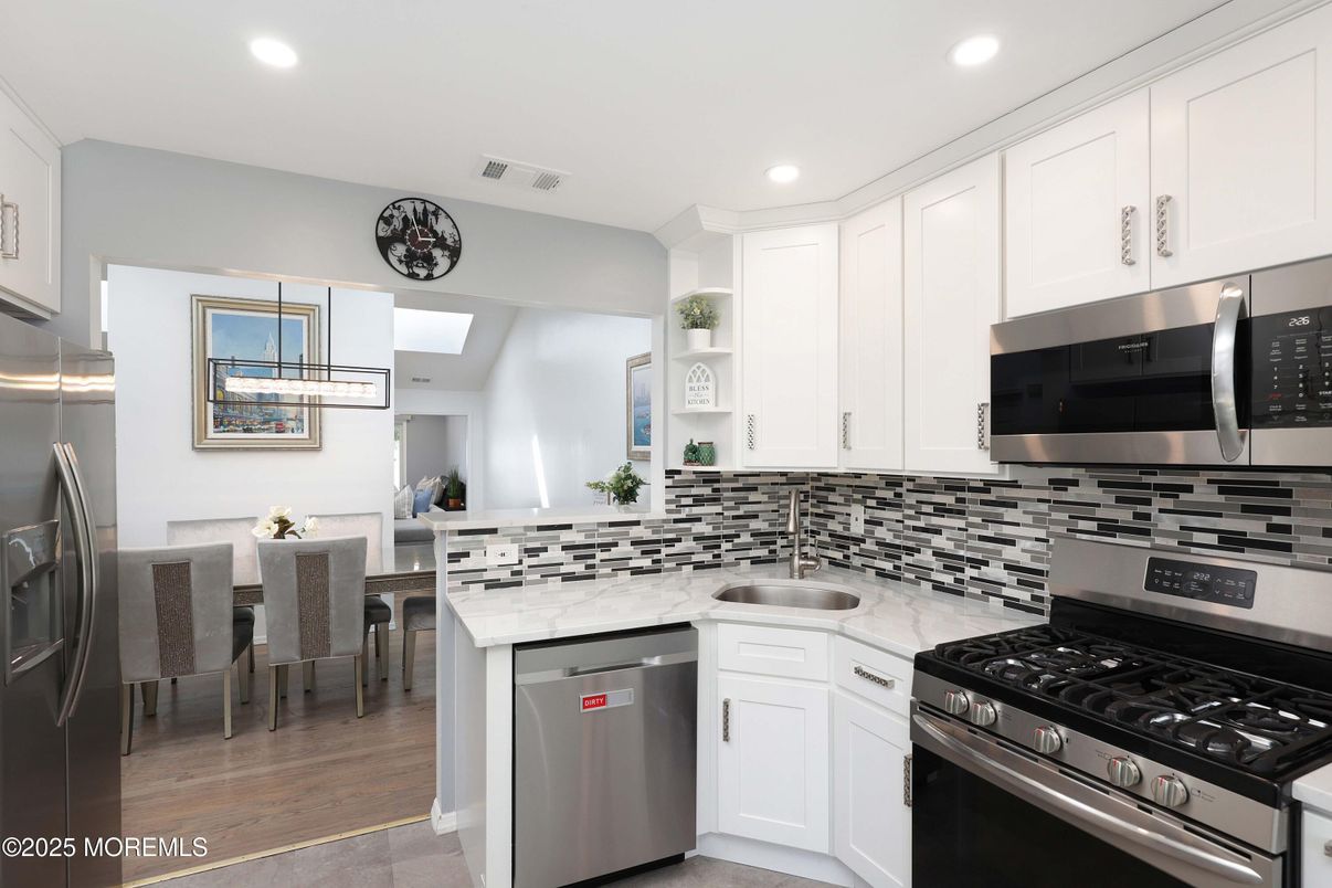 Dining room, Interior, Kitchen, Recessed Lighting, Stainless Steel Appliances, Wood Texture Flooring